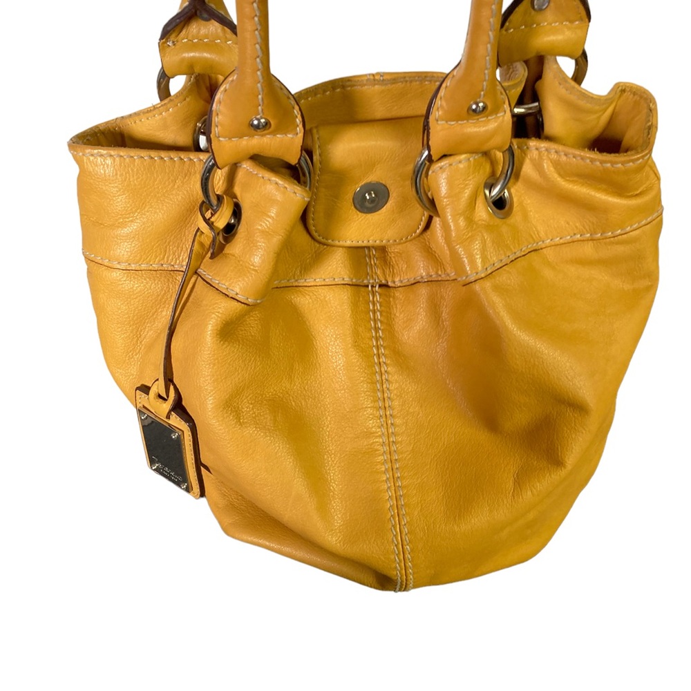 Tignanello mustard yellow handbag. Multi striped color lining.